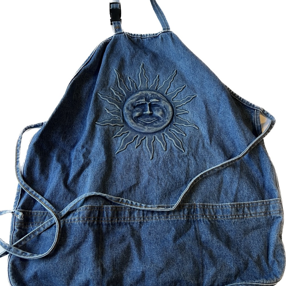 Denim apron with embossed sun